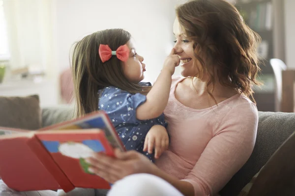 Family time for reading a book — Stock Photo, Image