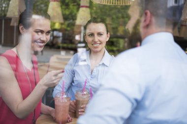 successful business people in cafe and talking