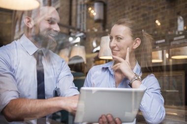 Successful business people with tablet