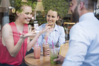 Successful young people drinking cocktails