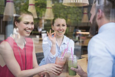 Successful young people drinking cocktails
