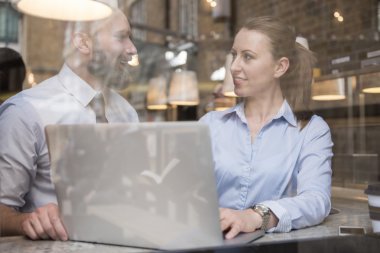 successful business people in cafe with laptop