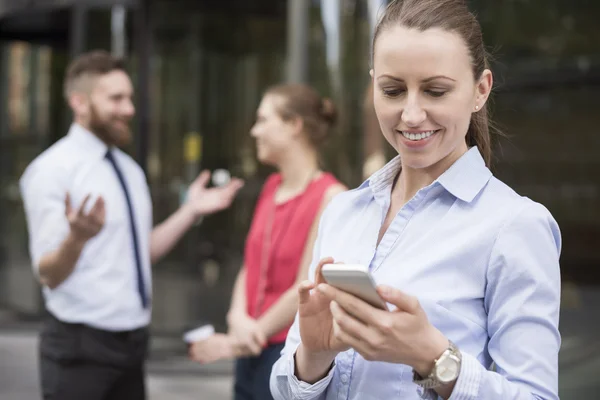 Successful  businesswoman with phone — 图库照片