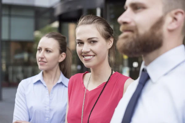 Successful business people smiling — ストック写真