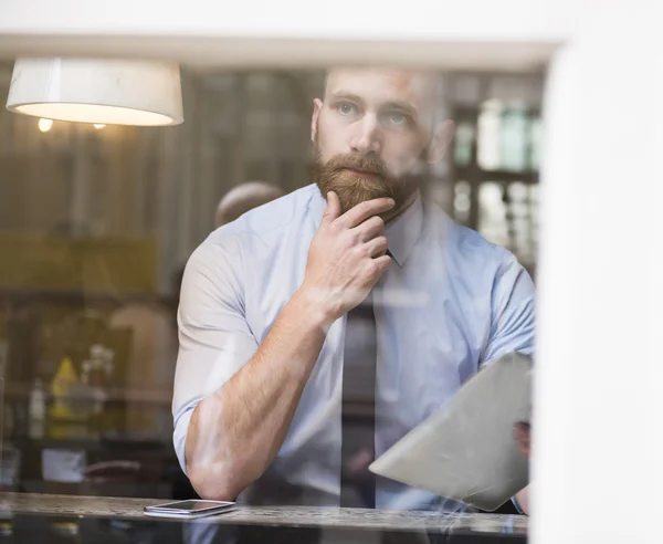 Successful businessman with tablet — Stock Photo, Image