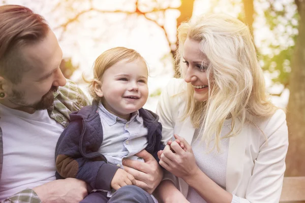 Young family in park with son — Stock Photo, Image