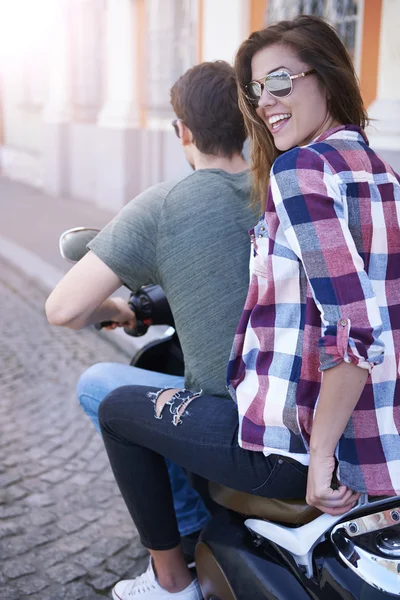 Young couple riding bike in city — Stock Photo, Image