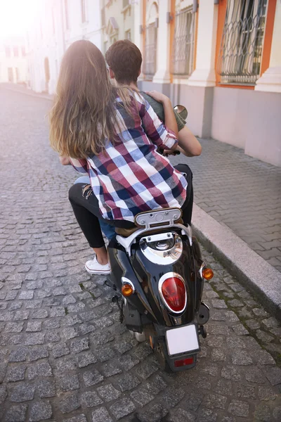 Young couple riding bike in city — Stock Photo, Image