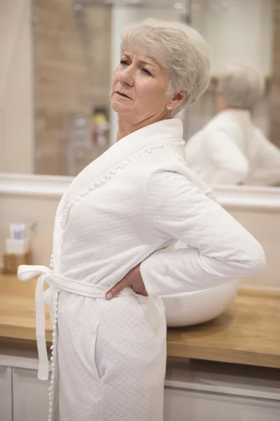 Mature woman with back ache — Stock Photo, Image