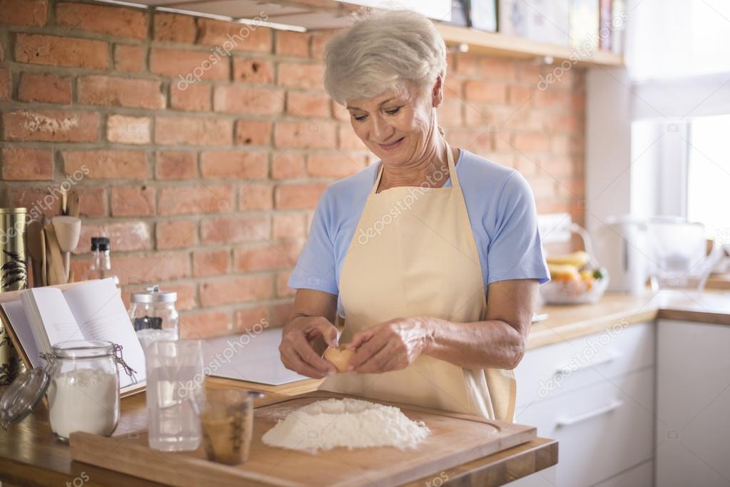 mature woman preparing tasty food