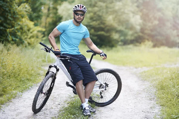 Young bicycle rider sitting on bike — Stock Photo, Image