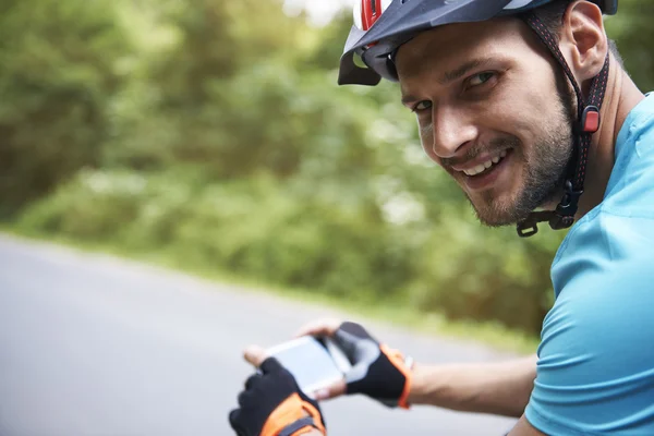 Young bicycle rider smiling — Stock Photo, Image