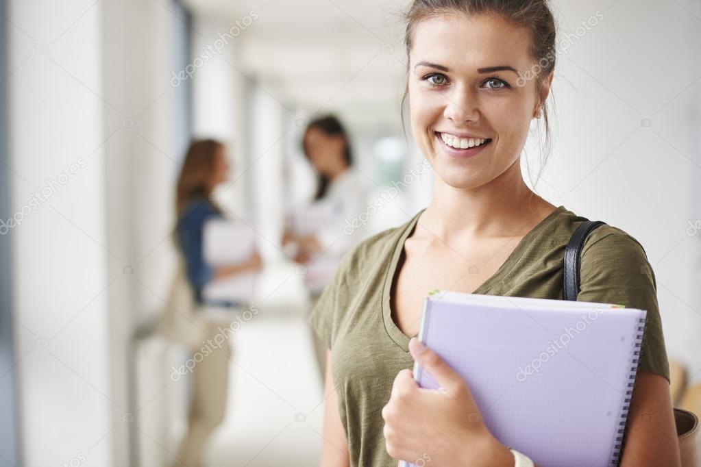Attractive student with notebook