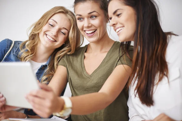 Best friends taking selfie on mobile phone Stock Photo