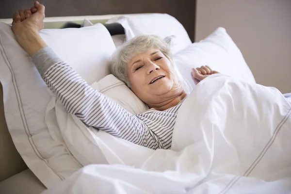 Mature woman in bed — Stock Photo, Image