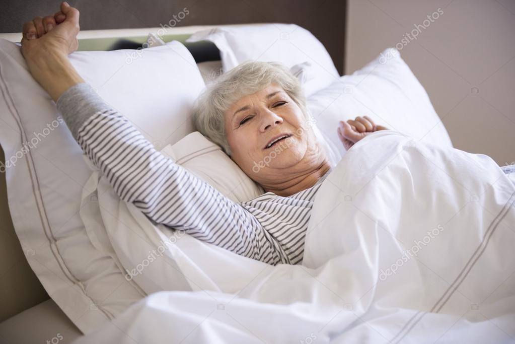 mature woman in bed