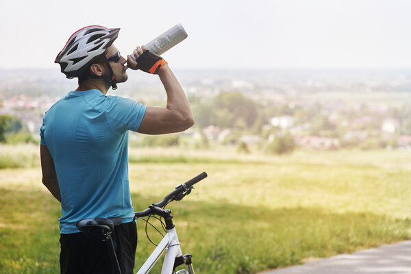 Man drinks water from bottle