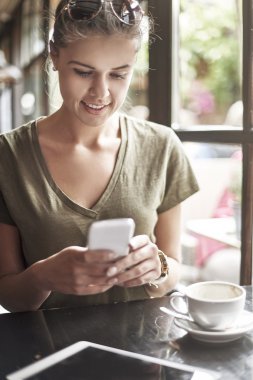 woman Checking news at smartphone