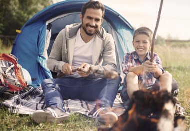 father with son camping