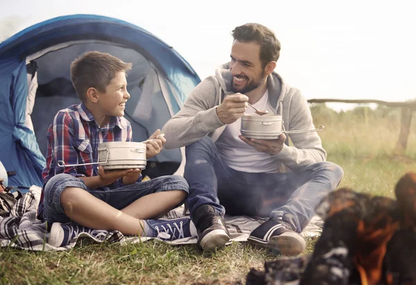 Father and son eating soup — Stock Photo, Image