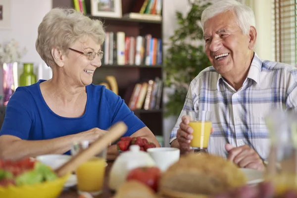 Grandparents eating breakfast together