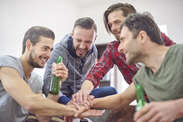 Friends stacking their hands together — Stock Photo, Image