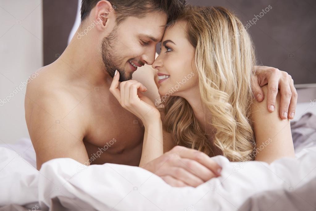 Cute Happy Couple In Bedroom Stock Photo C Gpointstudio