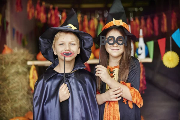 Witch and wizard in scary masks — Stock Photo, Image