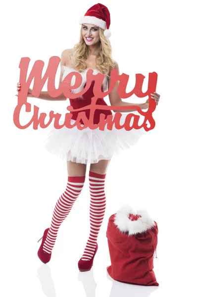 Santa Claus chica con signo de Feliz Navidad — Foto de Stock