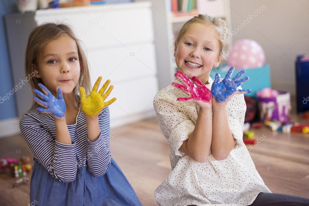 two girls making paintings