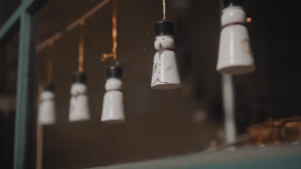 Little White Christmas Toys Snowmen Hang Thread Glass House — Stock Video