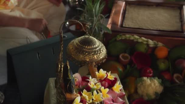 Benoa, Kuta, Kabupaten Badung, Bali, Indonesia - July 8, 2021: Photos of Bhaktivedanta Swami Prabhupada and Ramanujacharya in the framework stand on the table with flowers at the Krishna ceremony Yagya