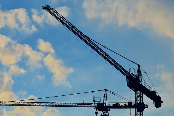 Silhouettes construction cranes — Stock Photo, Image