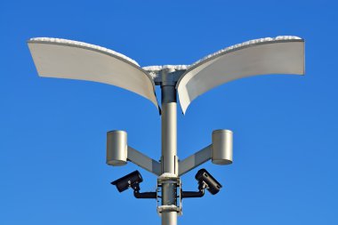 Surveillance cameras and modern lighting clipart
