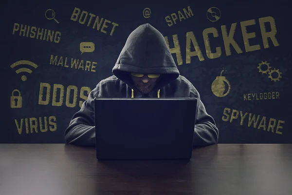 Computer hacker stealing information with laptop — Stock Photo, Image