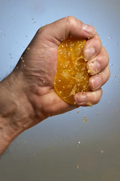 Hand Squeezing an Orange — Stock Photo, Image
