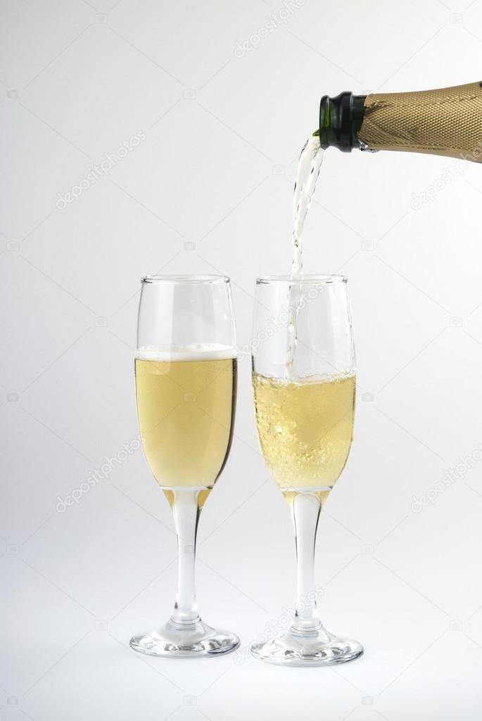 Pouring cava on a cup