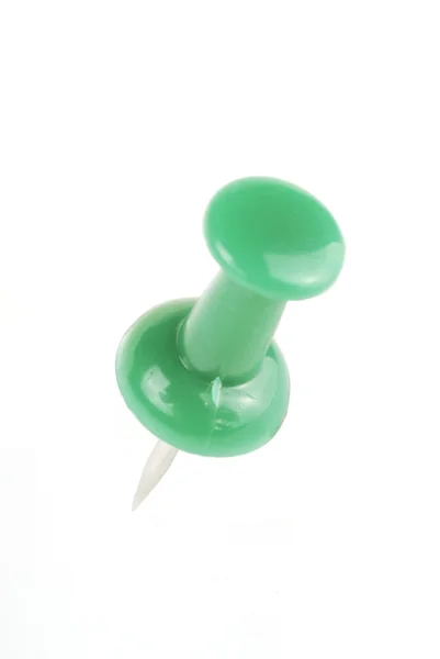 Green thumbtack on white background — Stock Photo, Image