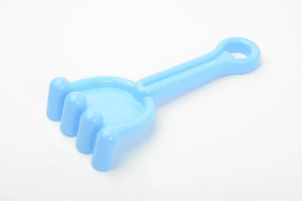 Toy, blue plastic rake — Stock Photo, Image
