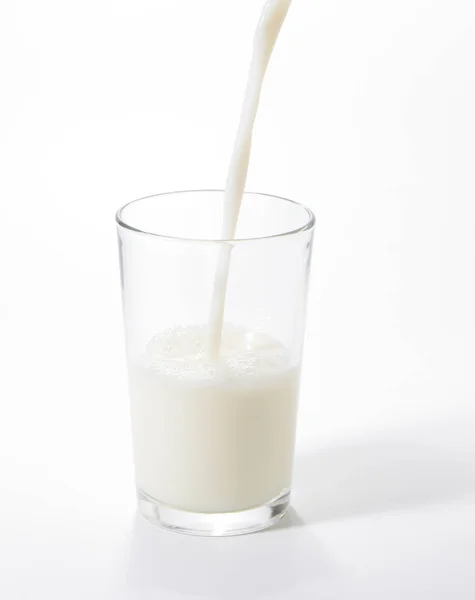 Pouring Milk Glass White Background — Stock Photo, Image