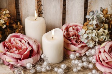 Romantic floral arrangement with roses and candles clipart