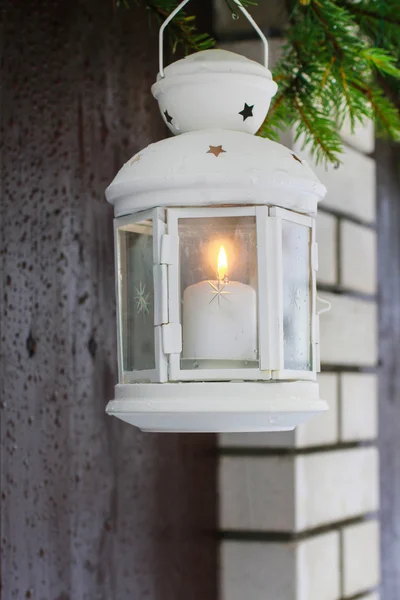 White lantern hanging on a fir branch. — Stock Photo, Image