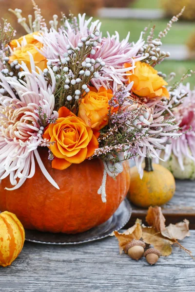 Bouquet of flowers in pumpkin — Stock Photo, Image