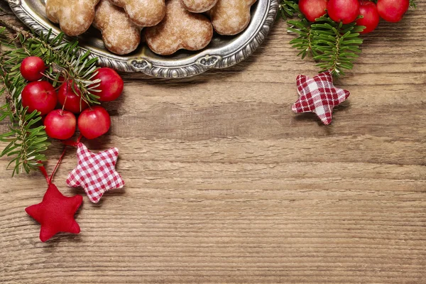 Paradise apples (Malus pumila Mill) and fir on wooden background — Stock Photo, Image