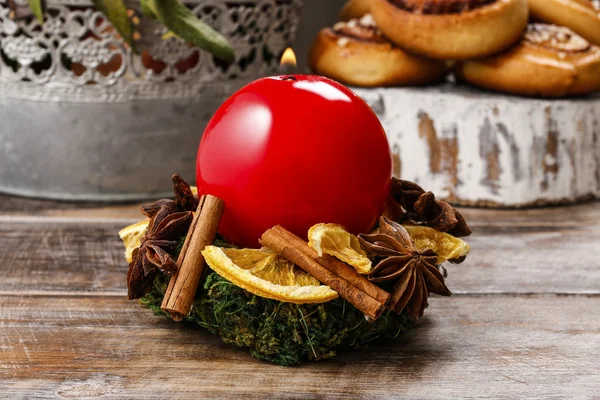 Christmas candle holder made of moss, dried fruits and cinnamon — Stock Photo, Image