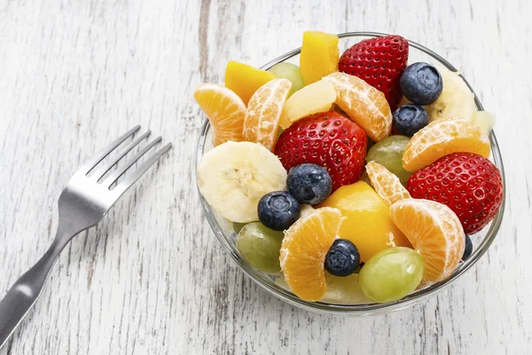 Fruit salad in glass bowl — Stock Photo, Image