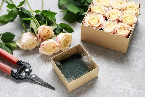 Florist workplace: how to make box with flowers, step by step