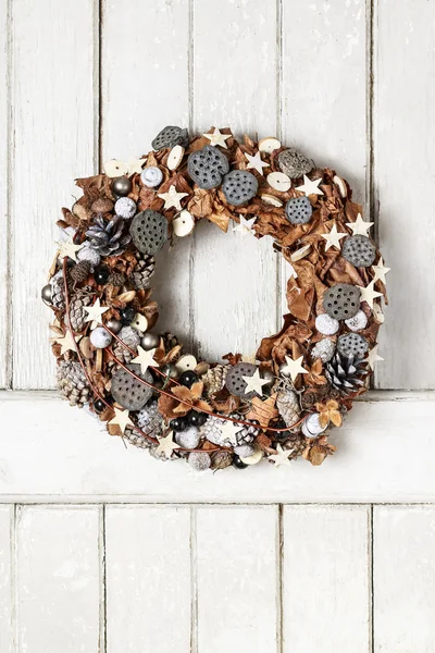 Christmas door wreath with dried fruits and leaves — Stock Photo, Image