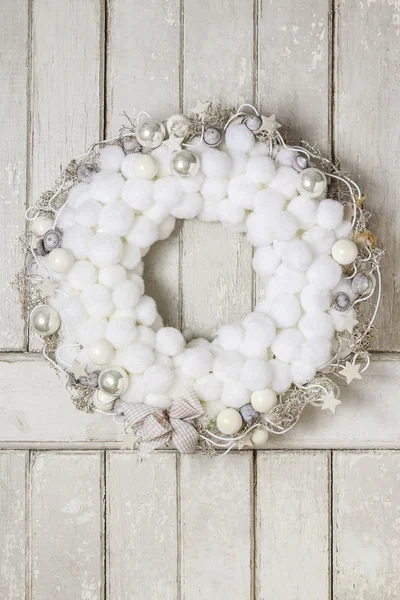 Christmas door wreath with white fluffy balls — Stock Photo, Image
