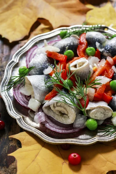 Pickled herring rolls with vegetables — Stock Photo, Image